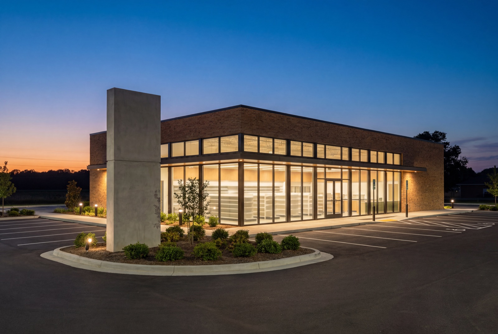 Single-tenant net-lease retail building at twilight