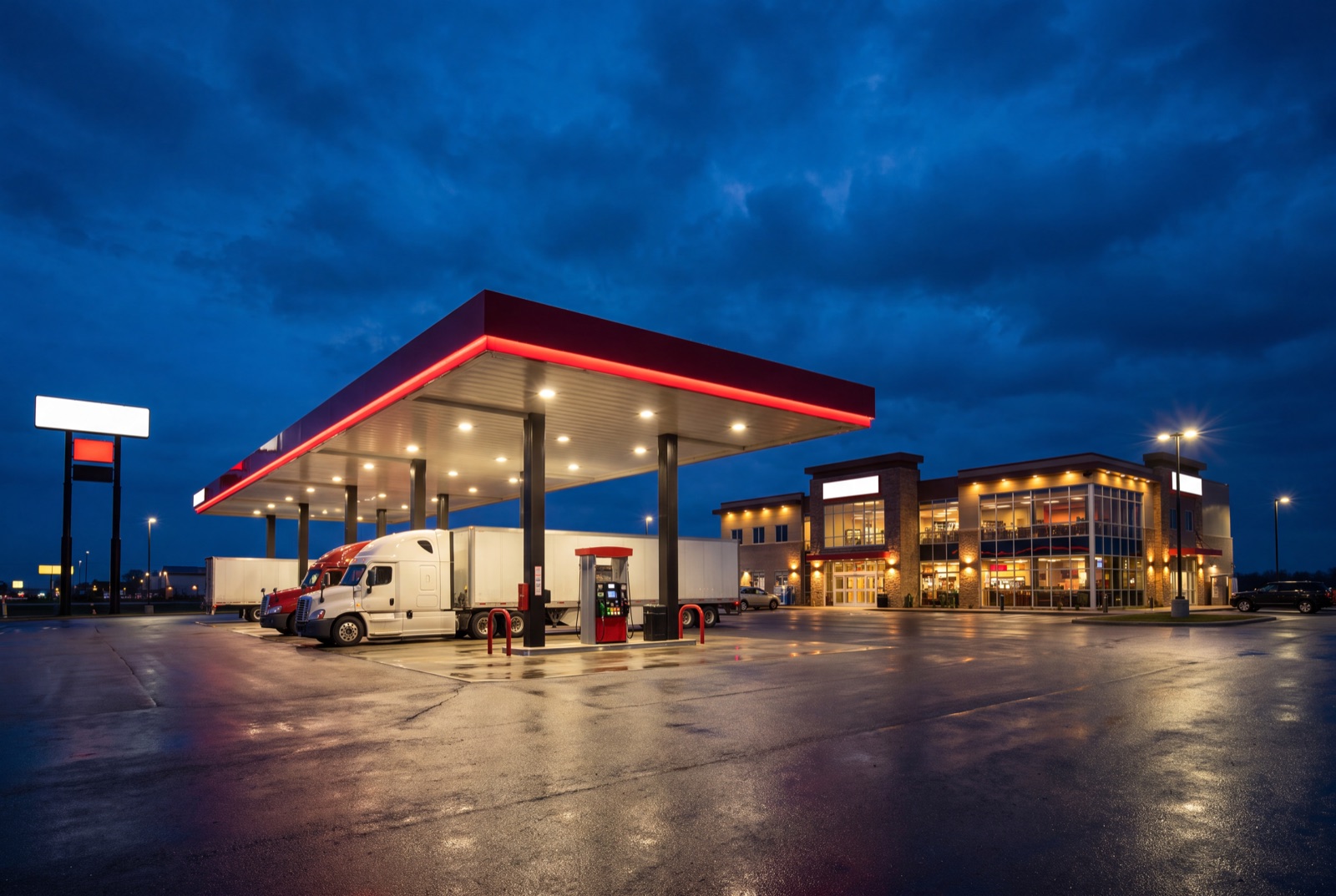 Highway travel center and truck stop at night